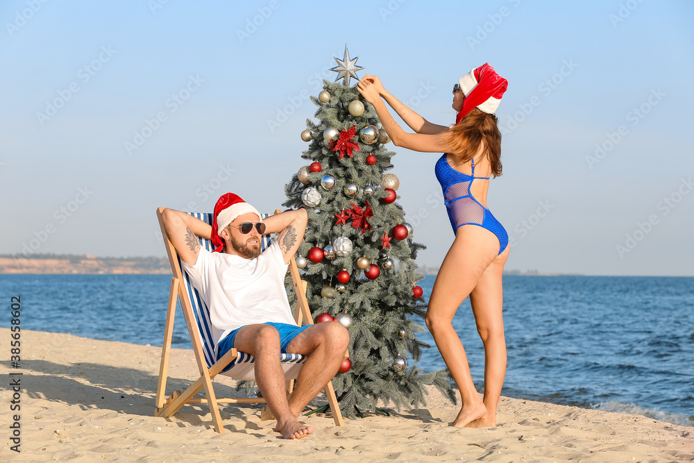 Happy couple celebrating Christmas at tropical resort