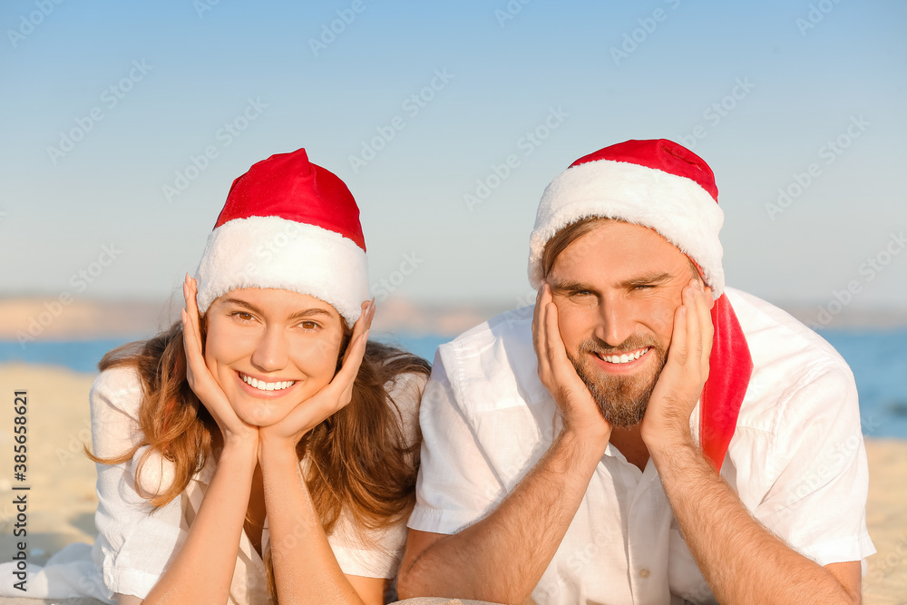 Happy couple celebrating Christmas at tropical resort