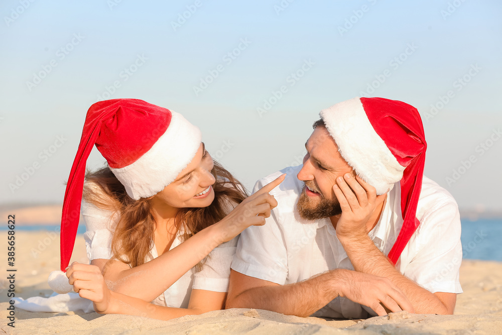 Happy couple celebrating Christmas at tropical resort