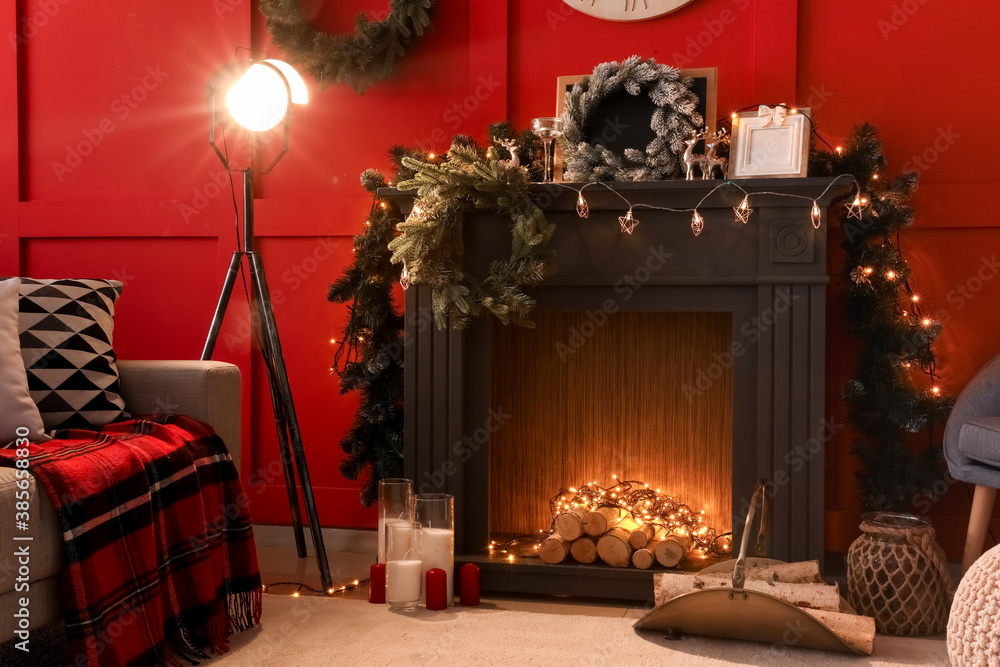 Decorated fireplace in interior of room on Christmas eve