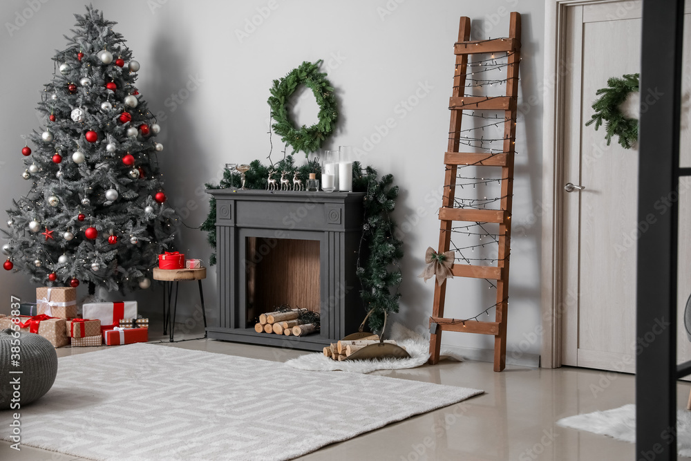 Decorated fireplace in interior of room on Christmas eve