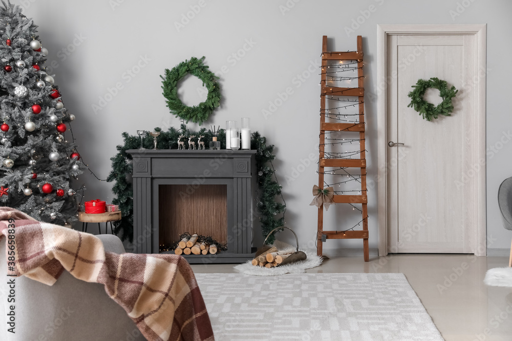 Decorated fireplace in interior of room on Christmas eve