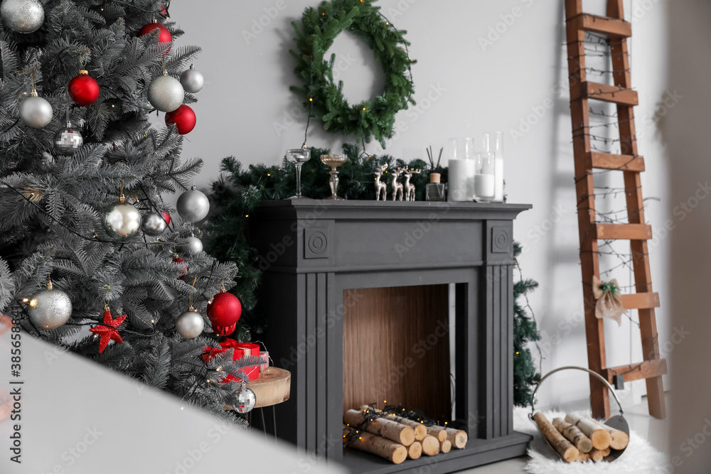 Decorated fireplace in interior of room on Christmas eve