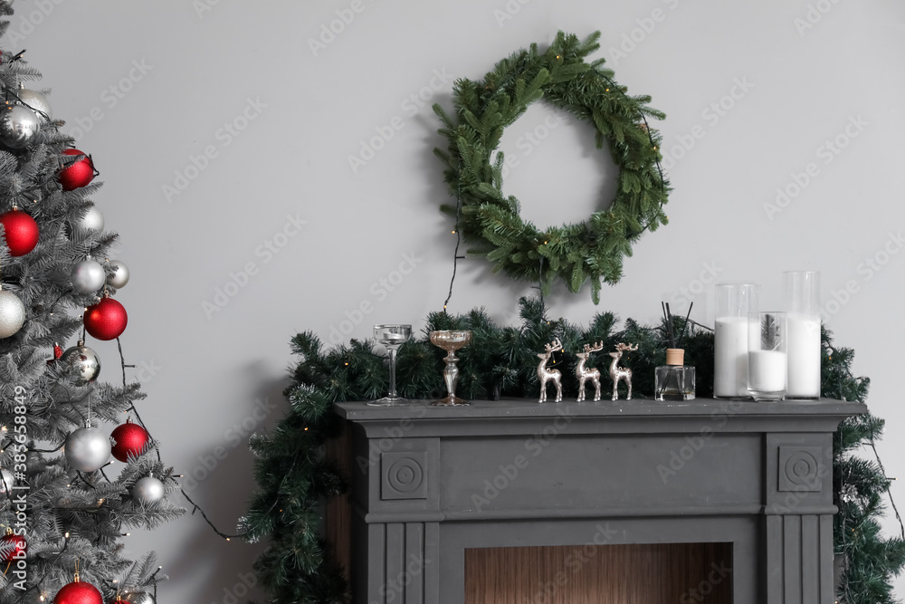 Decorated fireplace in interior of room on Christmas eve