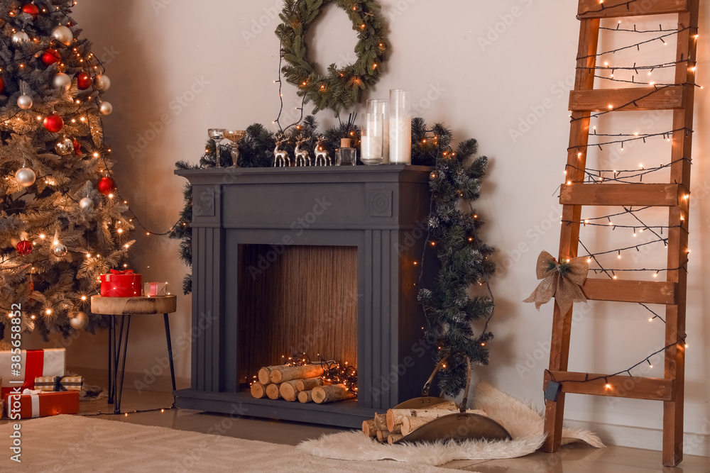 Decorated fireplace in interior of room on Christmas eve