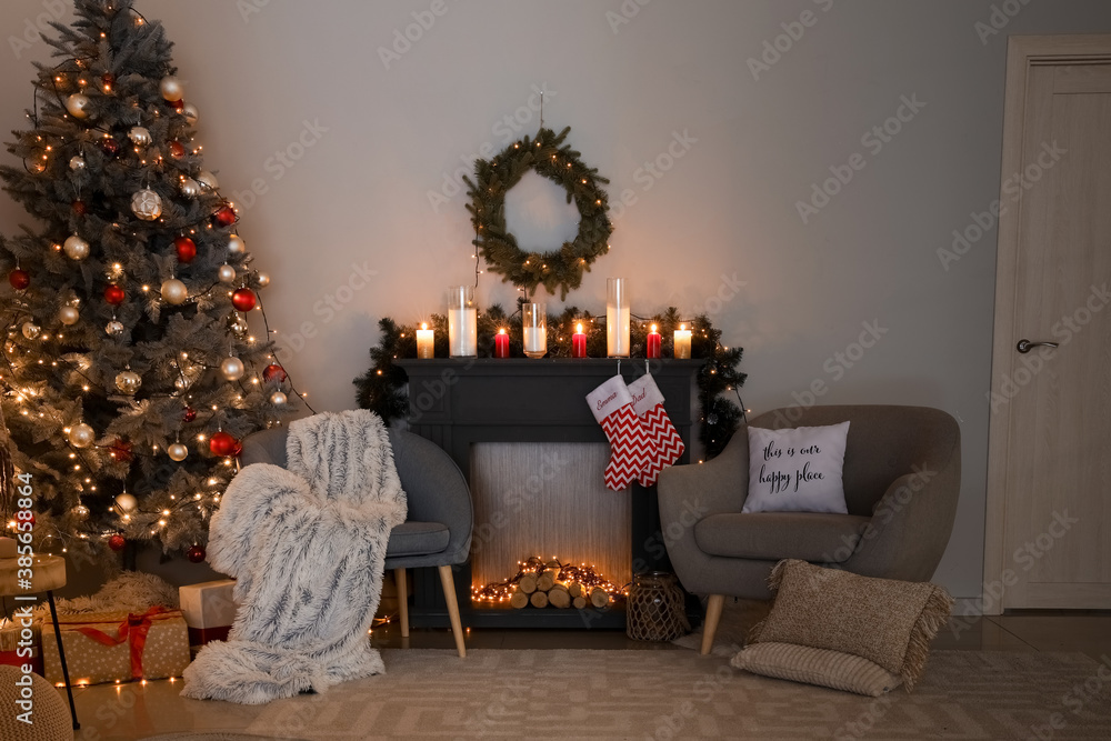 Decorated fireplace in interior of room on Christmas eve