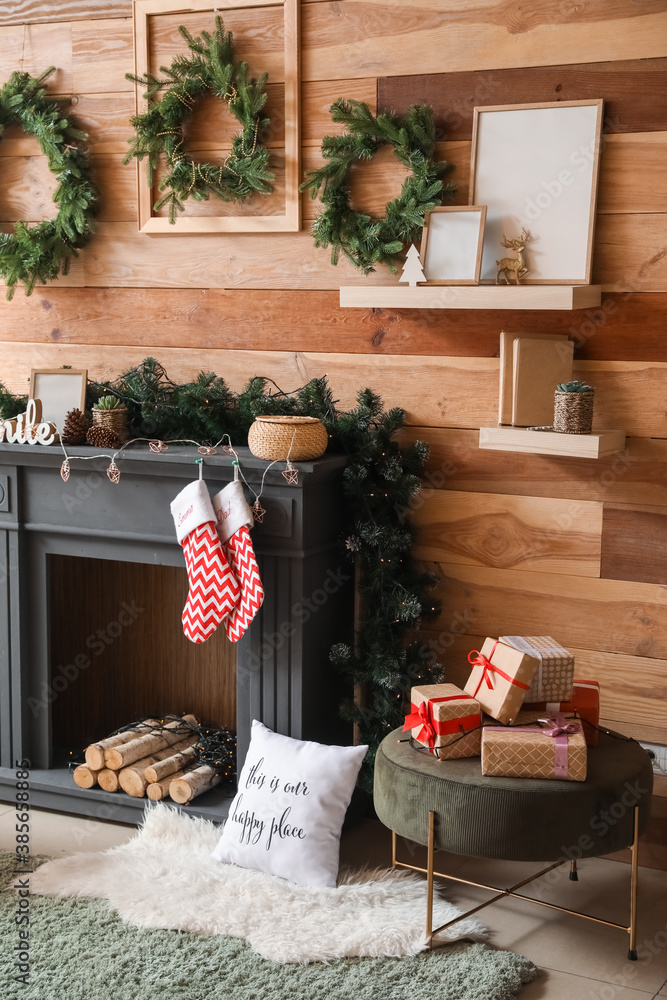 Decorated fireplace in interior of room on Christmas eve