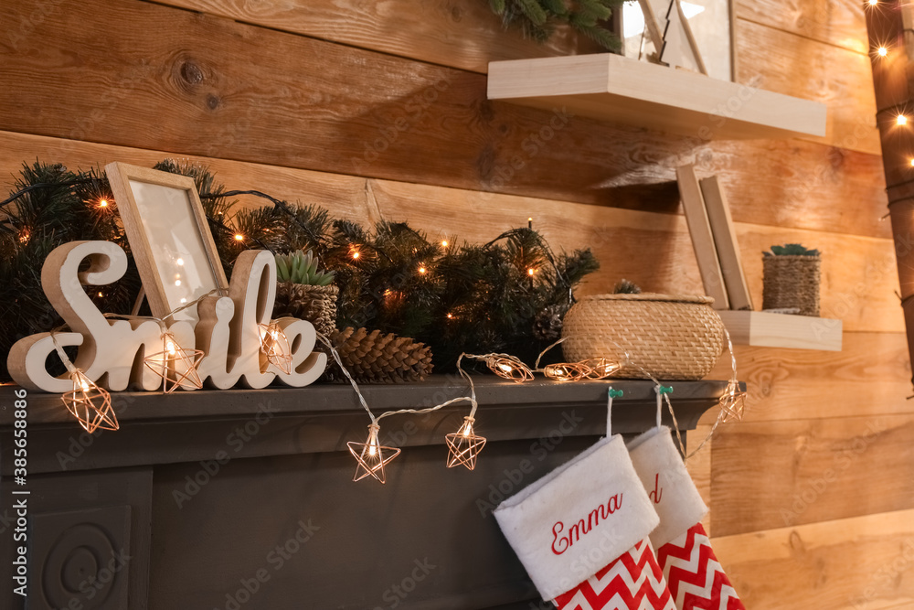 Decorated fireplace in interior of room on Christmas eve