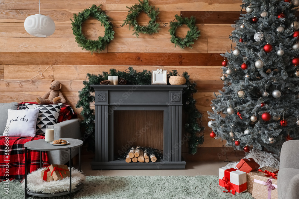 Decorated fireplace in interior of room on Christmas eve