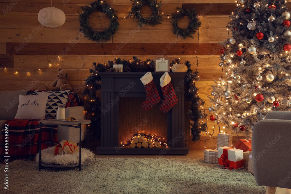 Decorated fireplace in interior of room on Christmas eve