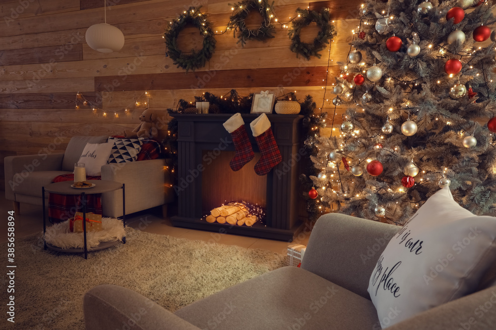 Decorated fireplace in interior of room on Christmas eve