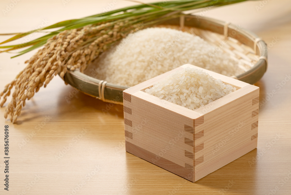 Rice in a Japanese Masu in a wooden background