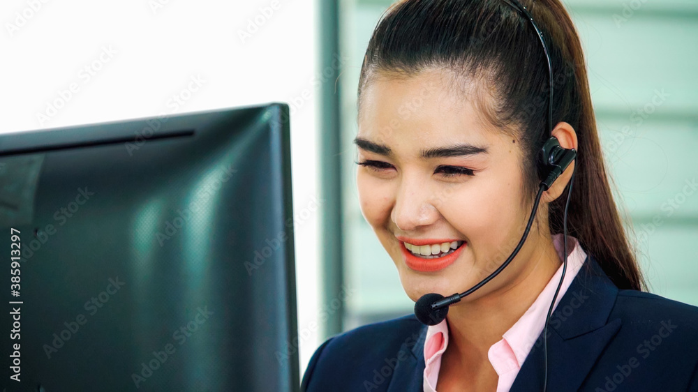 Business people wearing headset working in office to support remote customer or colleague. Call cent