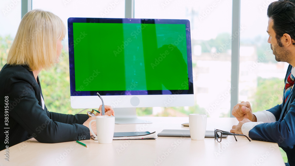 Business people in the conference room with green screen chroma key TV or computer on the office tab