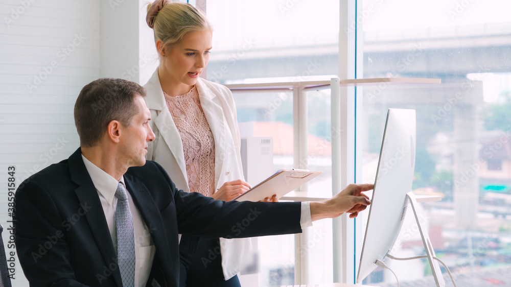 Two business people talk project strategy at office meeting room. Businessman discuss project planni