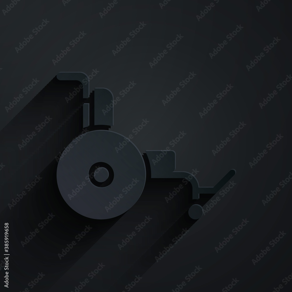 Paper cut Wheelchair for disabled person icon isolated on black background. Paper art style. Vector.