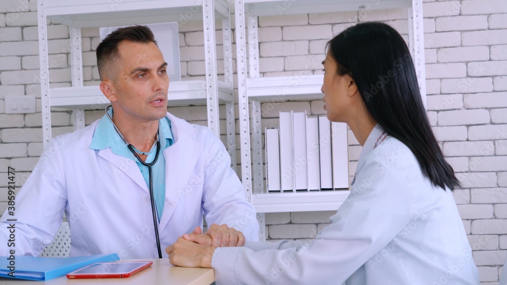 Doctor in professional uniform examining patient at hospital or medical clinic. Health care , medica