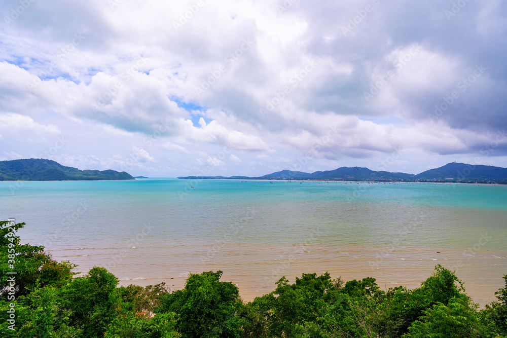 Tropical paradise sea with small island and trees frame in the foreground, Travel tourism background