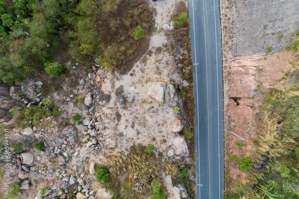 Asphalt road curve on high mountain image by Drone top down High angle view.