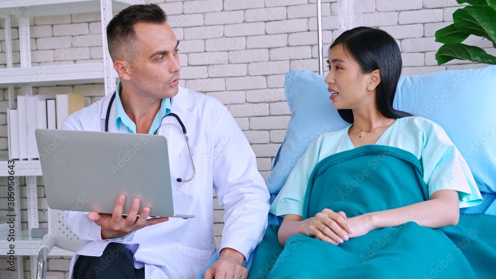 Doctor in professional uniform examining patient at hospital or medical clinic. Health care , medica