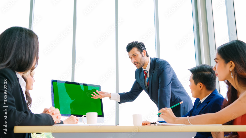 Business people in the conference room with green screen chroma key TV or computer on the office tab