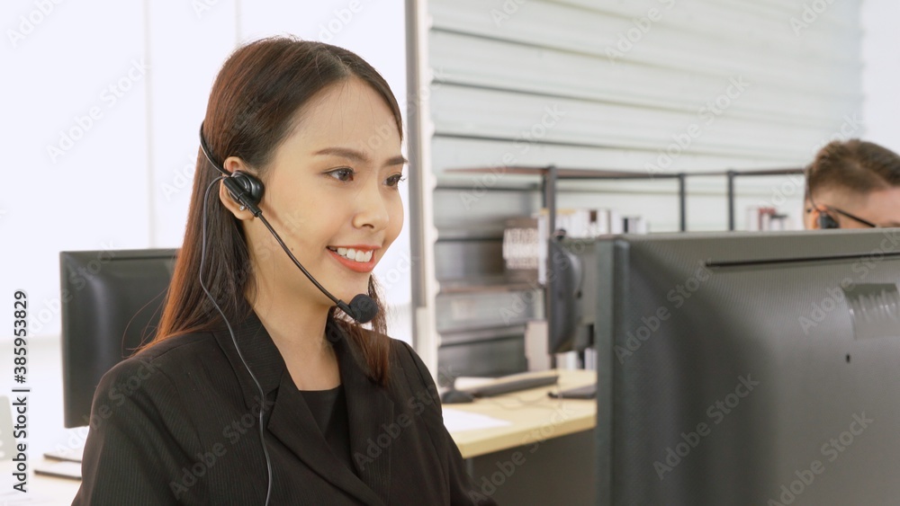 Business people wearing headset working in office to support remote customer or colleague. Call cent