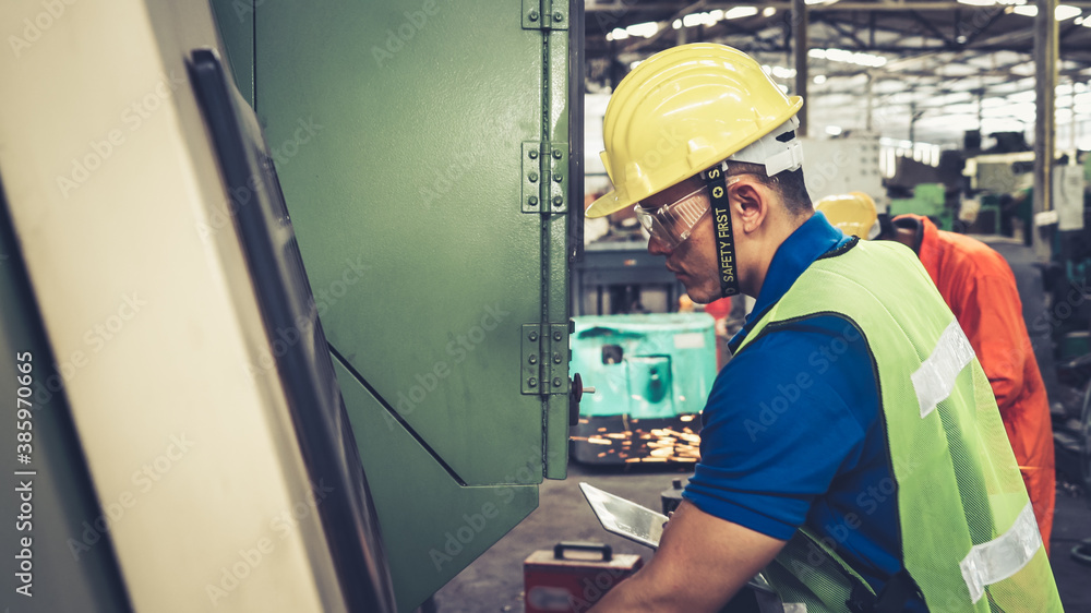 Smart factory worker using machine in factory workshop . Industry and engineering concept.