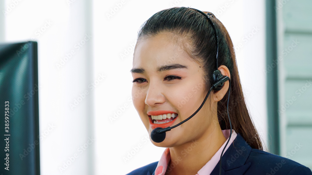 Business people wearing headset working in office to support remote customer or colleague. Call cent