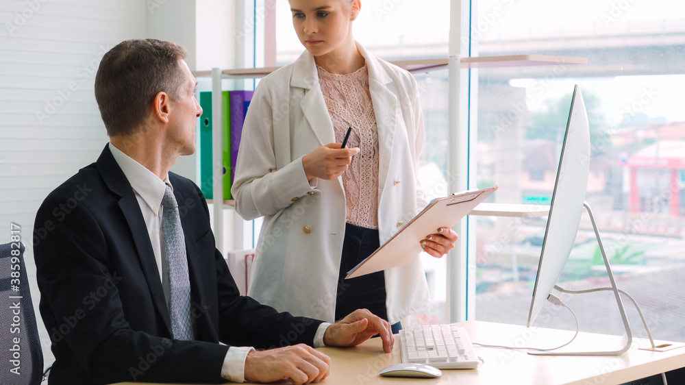 Two business people talk project strategy at office meeting room. Businessman discuss project planni