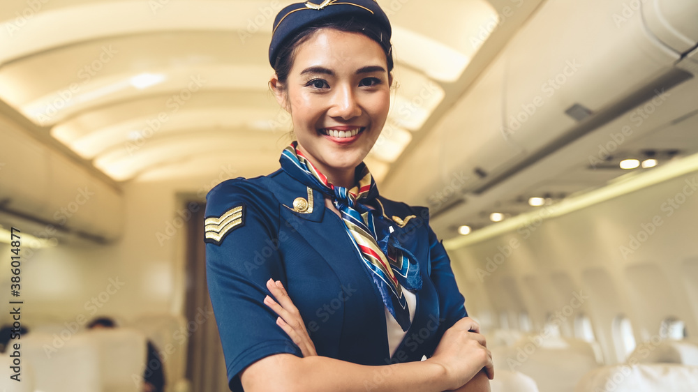 Cabin crew or air hostess working in airplane . Airline transportation and tourism concept.