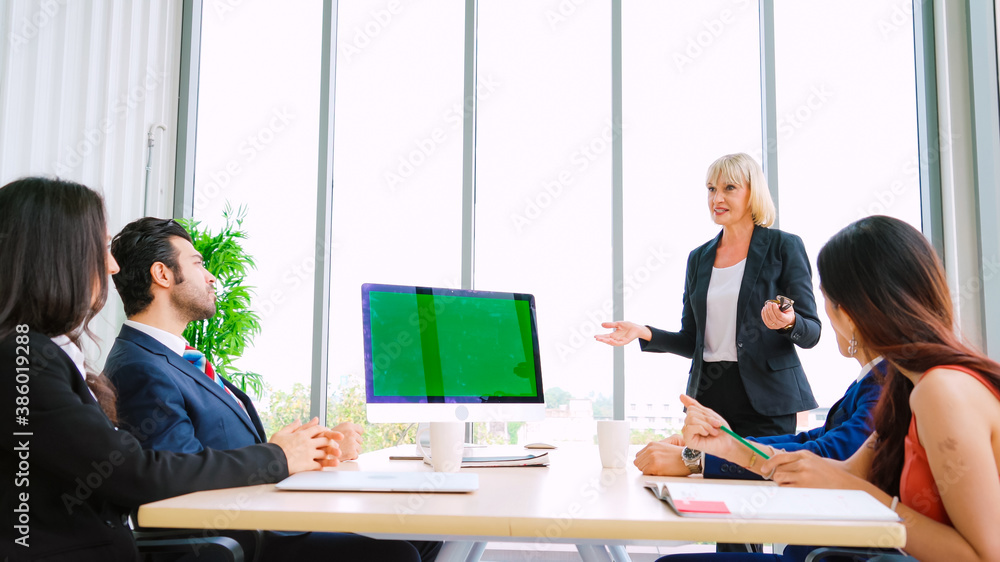 Business people in the conference room with green screen chroma key TV or computer on the office tab