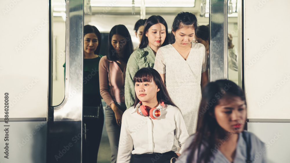 Crowd of people on a busy crowded public subway train travel . Commuting and urban lifestyle concept