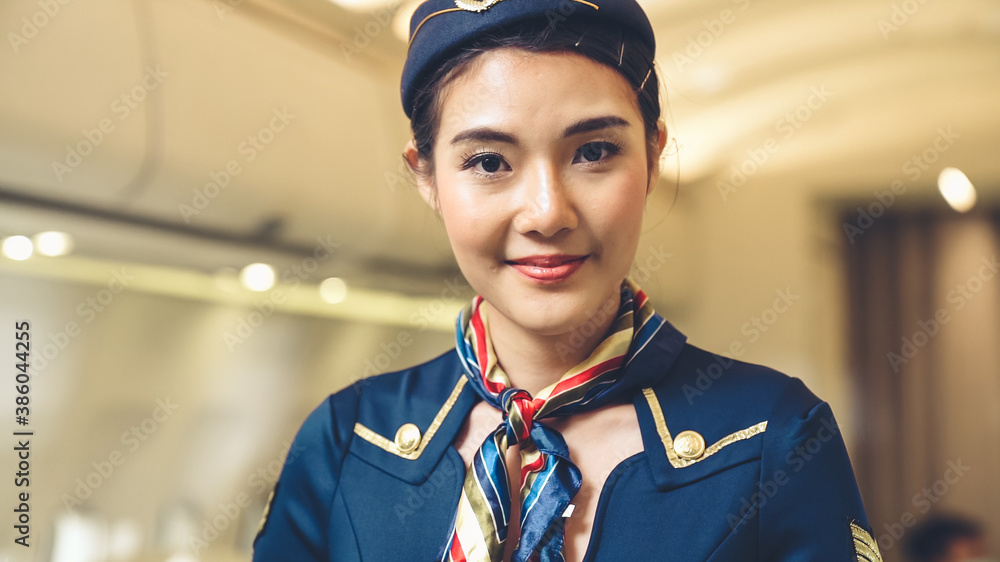 Cabin crew or air hostess working in airplane . Airline transportation and tourism concept.