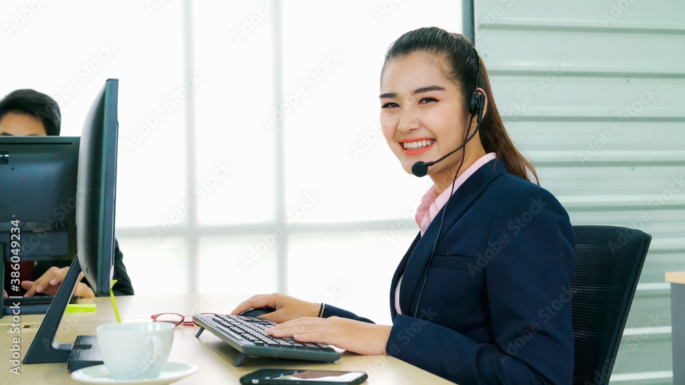 Business people wearing headset working in office to support remote customer or colleague. Call cent