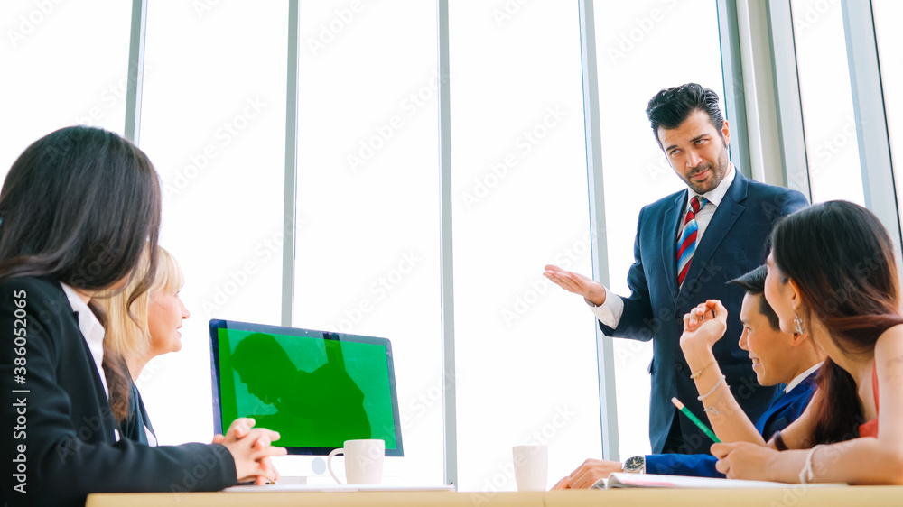 Business people in the conference room with green screen chroma key TV or computer on the office tab