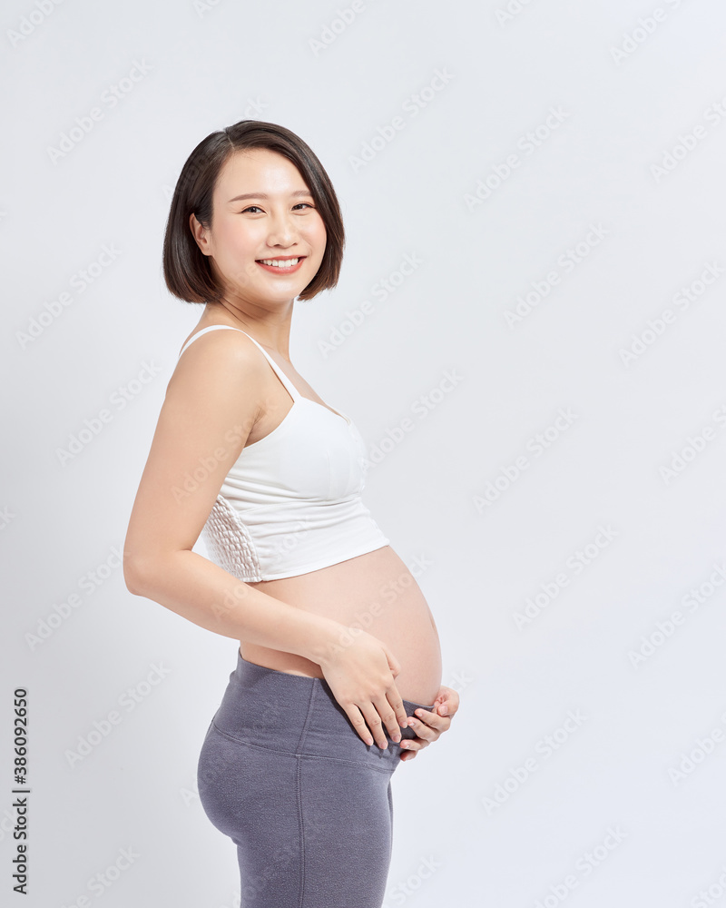 Portrait of the young happy smiling pregnant woman