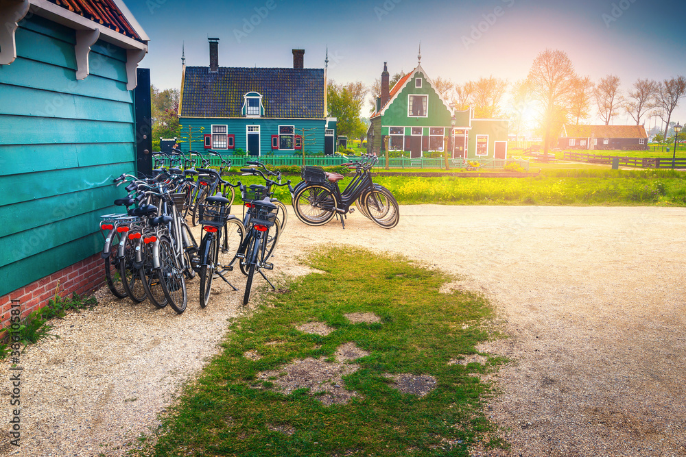 Tourist bicycles and cute wooden houses in Zaanse Schans, Netherlands