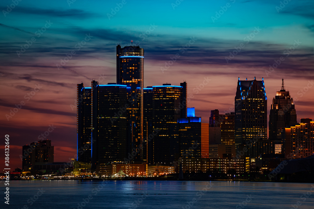 Close photo of night view of Detroit downtown skyscrapers and river from sunset point of Belle Isle,