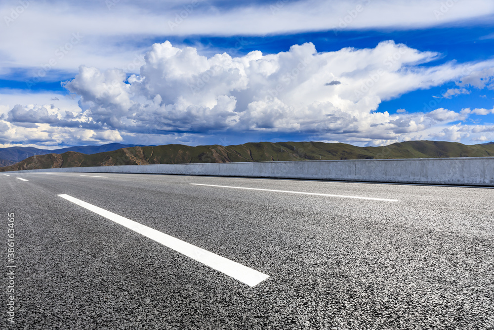 New asphalt road and mountain with sky cloud natural scenery.