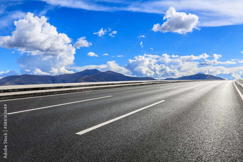 New asphalt road and mountain with sky cloud natural scenery.