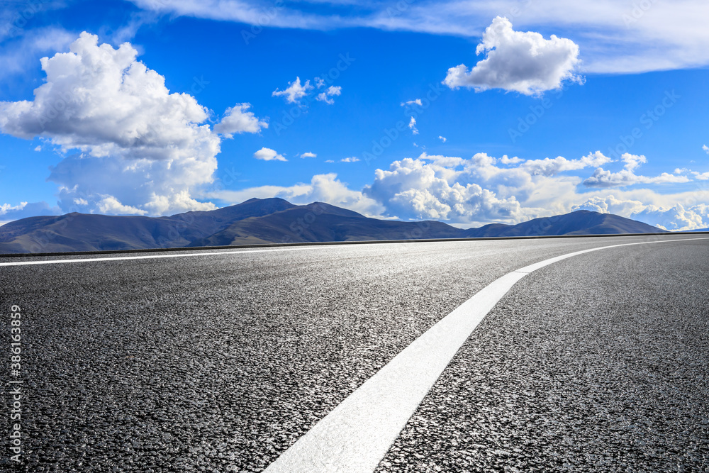 New asphalt road and mountain with sky cloud natural scenery.