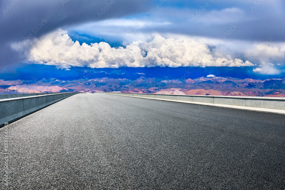 New asphalt road and mountain with sky cloud natural scenery.