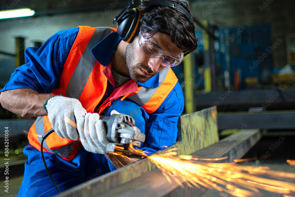 A male worker chia steel in an industrial factory. Concept industry.