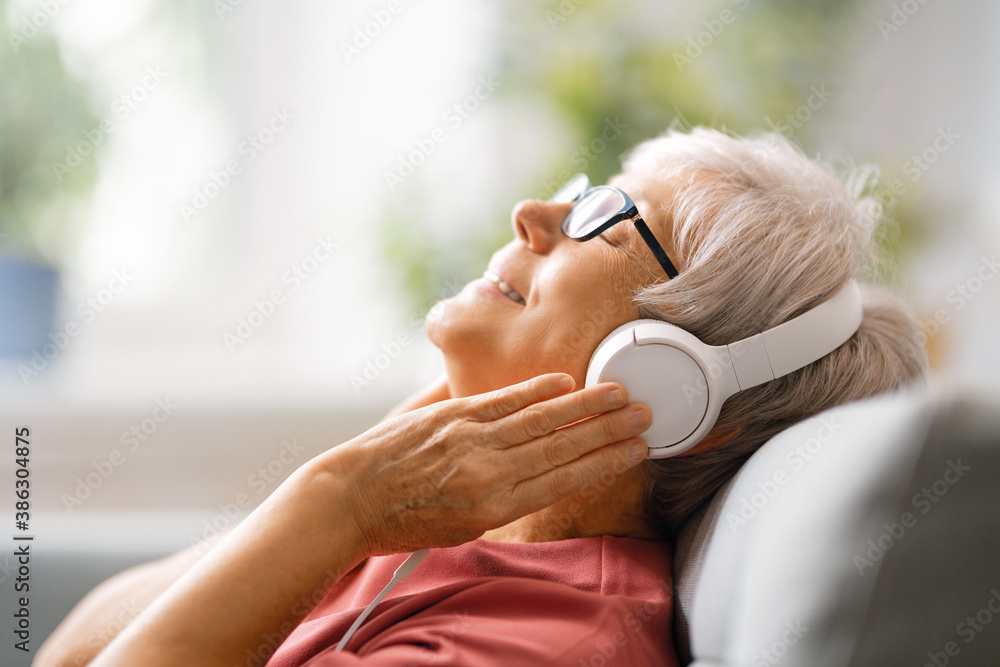 Senior woman listening to music