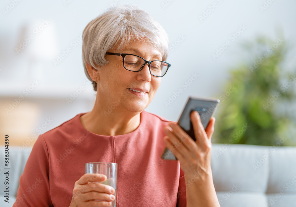 senior woman is using smartphone