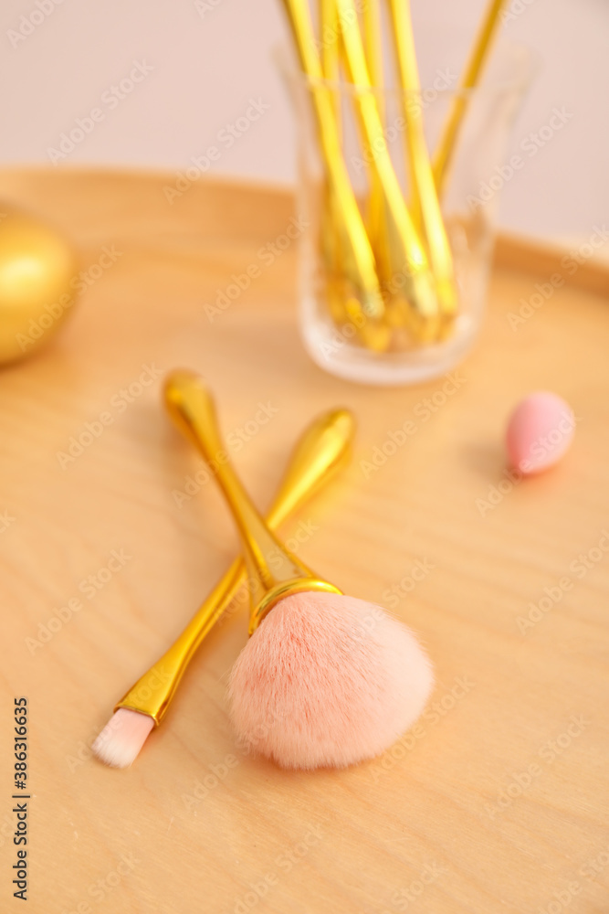 Different makeup brushes on tray