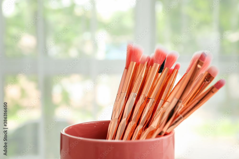 Set of makeup brushes indoors, closeup