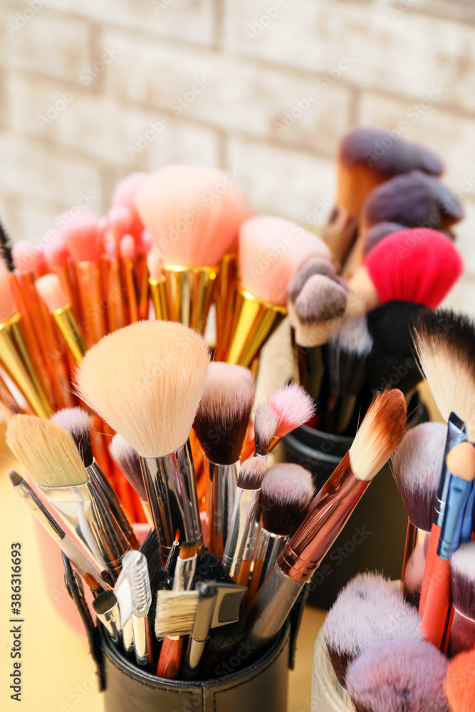 Set of makeup brushes on table, closeup