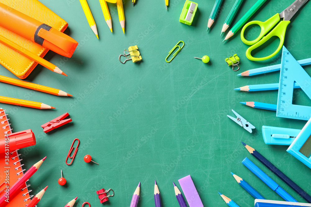 Frame made of school stationery on blackboard