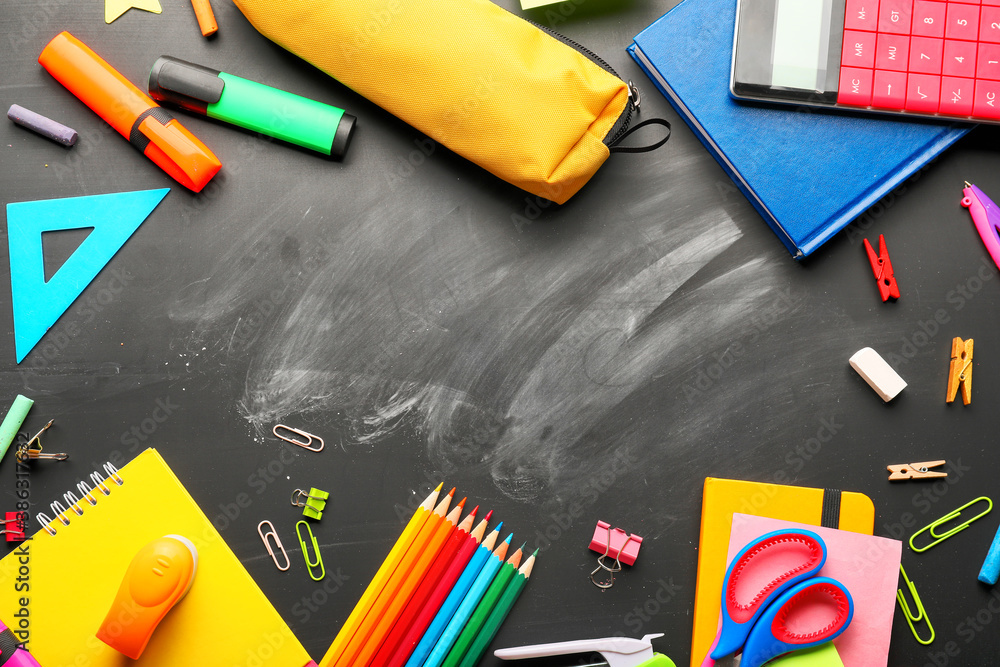 Frame made of school stationery on blackboard